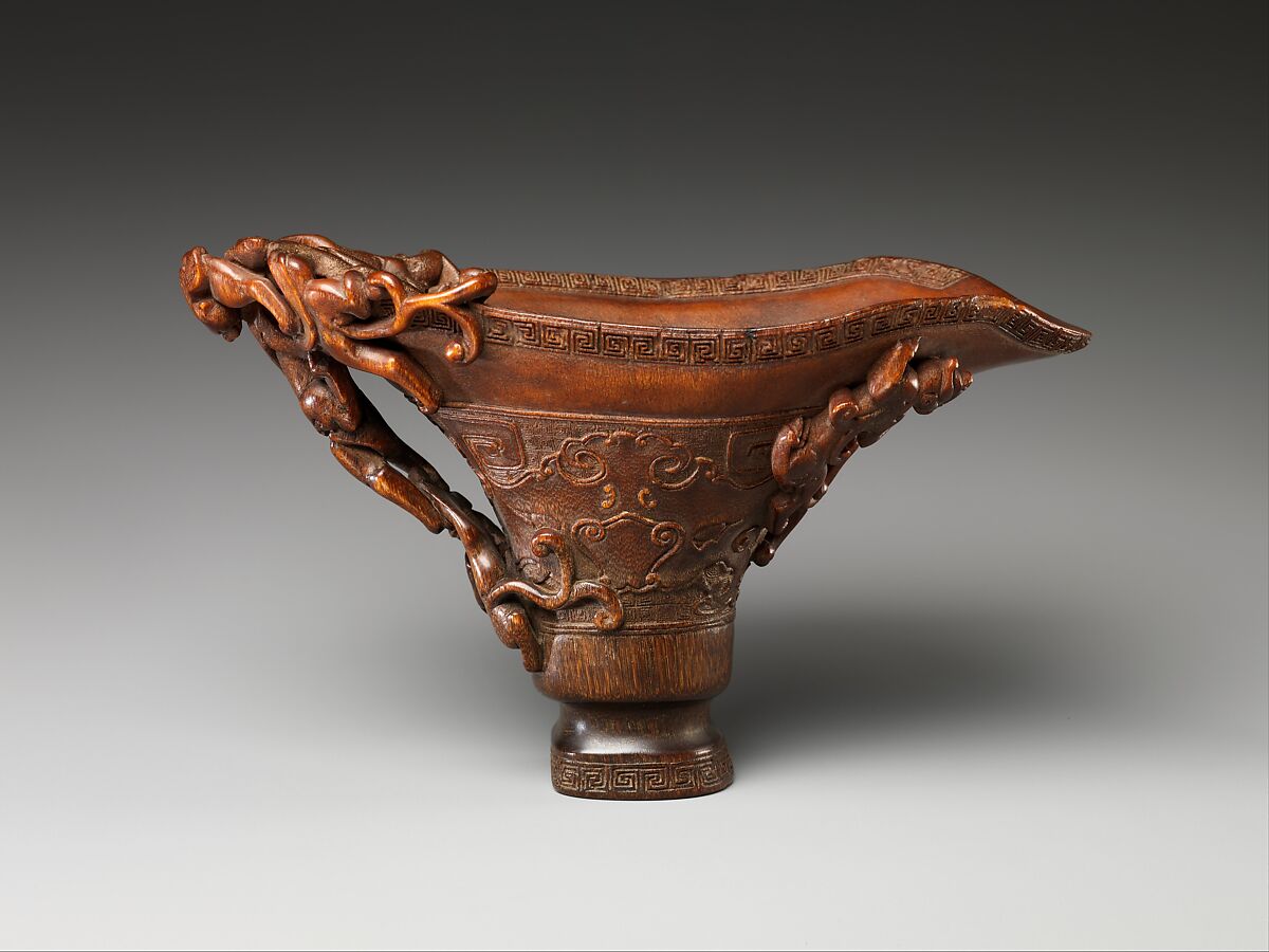犀角雕螭龍杯 Cup in the shape of an archaic vessel with feline