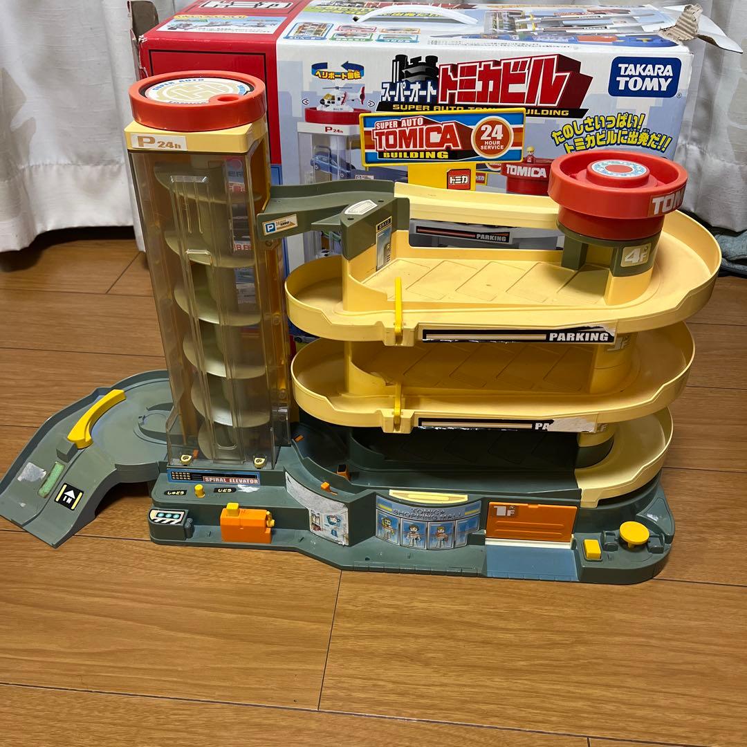 トミカ スーパーオートトミカビル - メルカリ